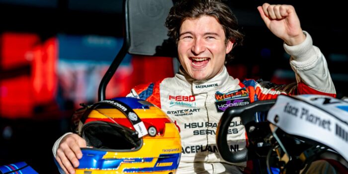 Go-karts racing on the track at Race Planet Delft