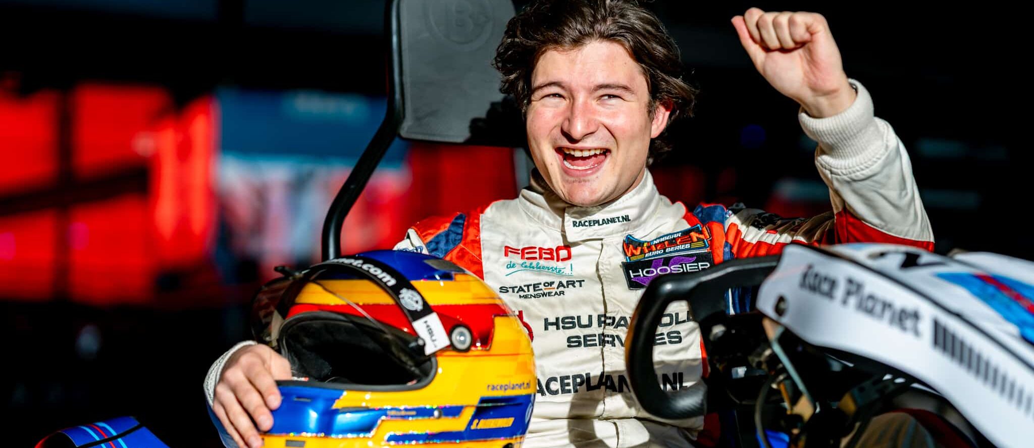 Go-karts racing on the track at Race Planet Delft